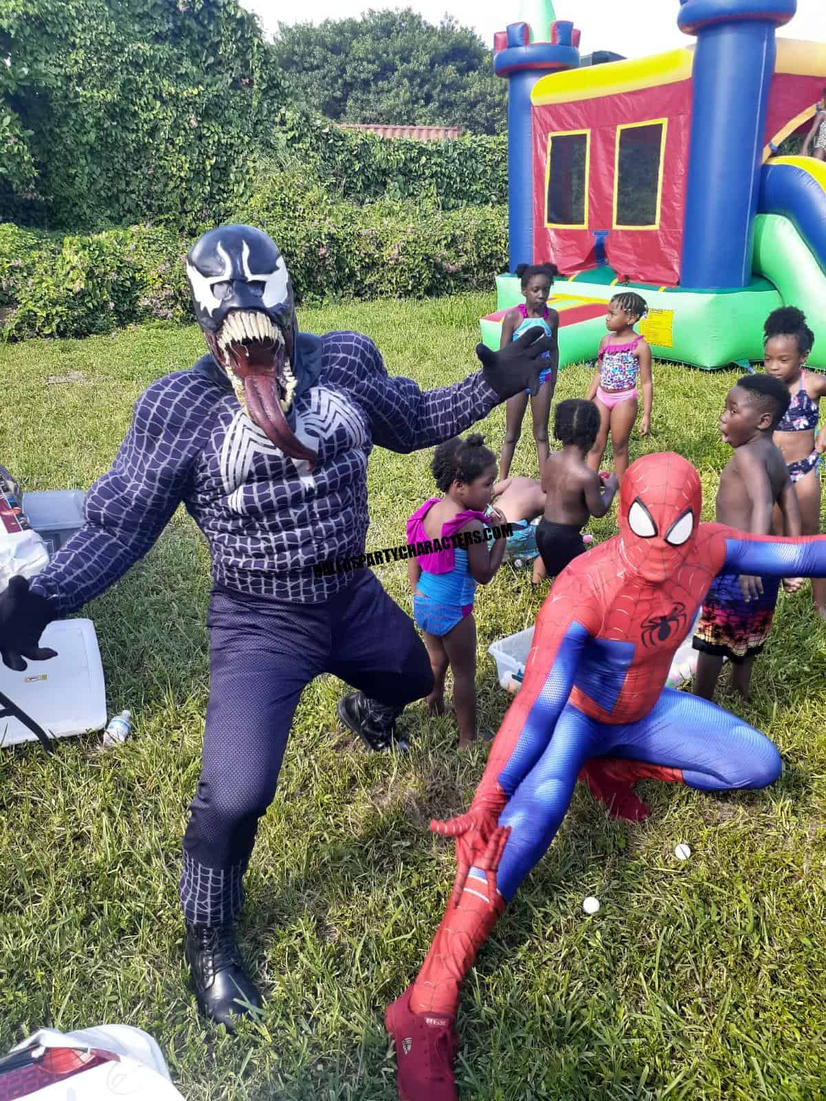 Superhero party character with kids at a Dallas birthday party